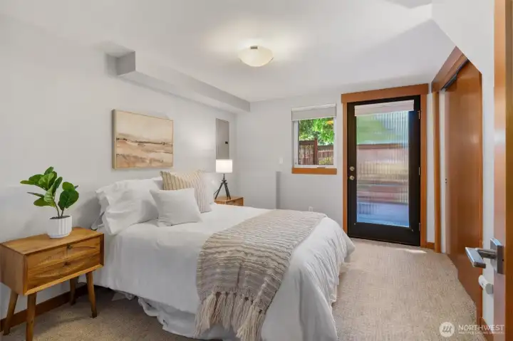 Lower level bedroom with an entrance to the patio - great for guests or home office.