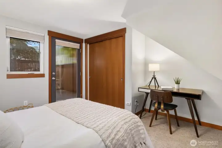 Lower level bedroom with an entrance to the patio - great for guests or home office.