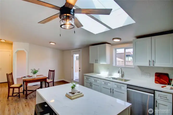 Beautiful kitchen with new cabinets, quartz counters, new sink, faucet and lighting. Beautiful kitchen with new cabinets, quartz counters, new sink, faucet and lighting.
