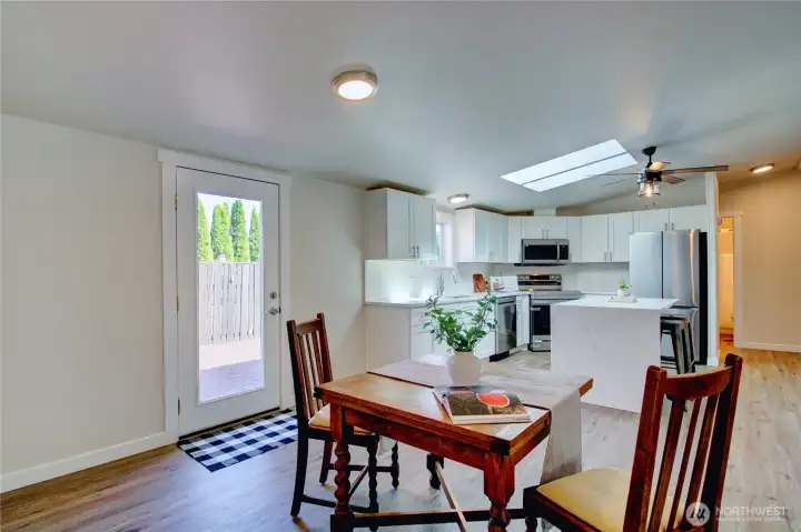 Dining room with back door that leads to porch with access to shed out back. Dining room with back door that leads to porch with access to shed out back.