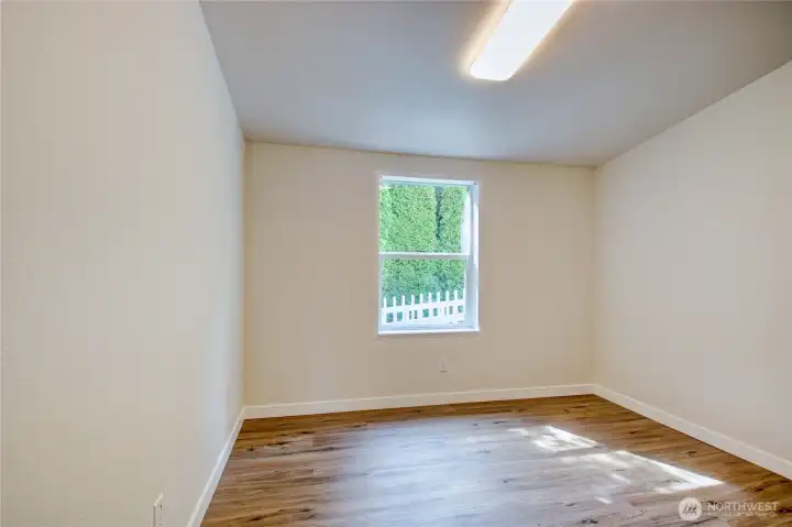 Second bedroom near main bathroom and laundry. Second bedroom near main bathroom and laundry.