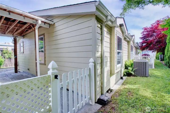 Fenced patio area with two storage sheds. Fenced patio area with two storage sheds.