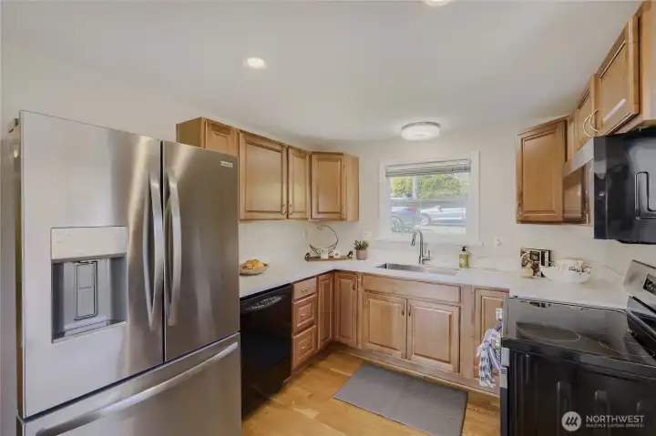 Look at this new fridge, newly painted, hardwoods continued in kitchen Look at this new fridge, newly painted, hardwoods continued in kitchen