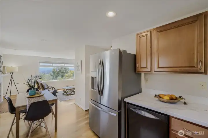 Kitchen opens to dining room and site lines to living room Kitchen opens to dining room and site lines to living room