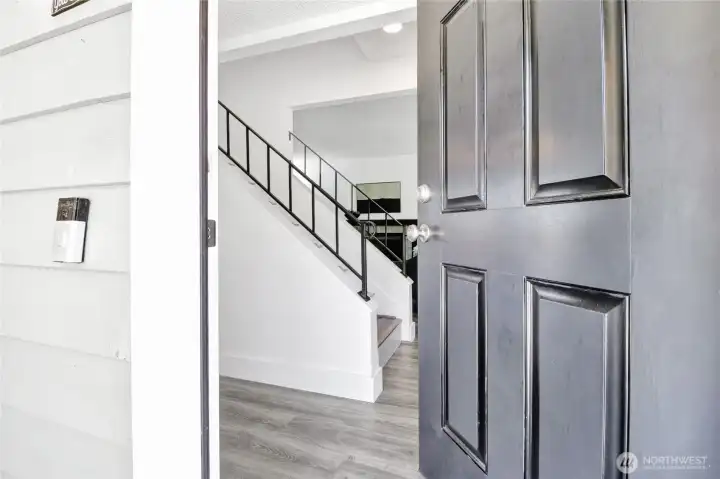 Enter through the new front door into the freshly painted main floor with all new 5"-6" trim, and new LVP flooring throughout. The flooring has gray & brown tones to match any color palette.