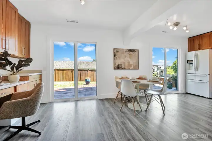 This is the dining area/flex space. With the kitchen on the right, ther is additional cabinetry on the left for loads of storage. There is a built-in desk that could be used as a homework station, home office area, or used for display, or as a food buffet for those BBQ parties.