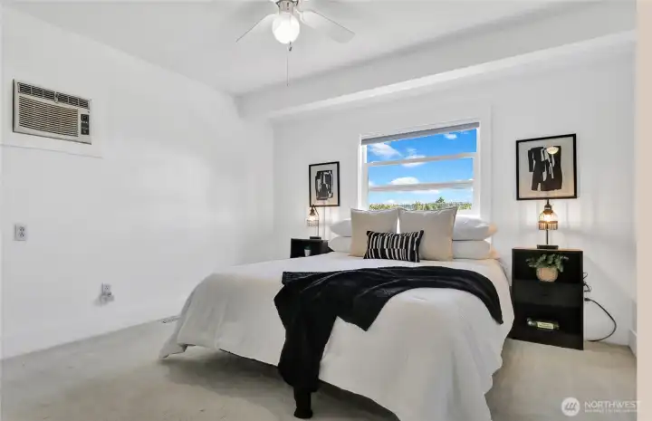 The primary bedroom has a built-in wall air-conditioner and ceiling fan for those warm summer days.