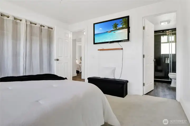 Located at the top of the stairs, the primary bedroom offers a large closet and ensuite bath with wall-in shower.