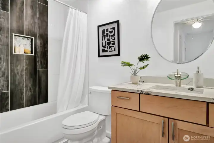 Full upstairs bath was also completely remodeled with new tile tub surround, new flooring, quartz countertops, flooring, etc.