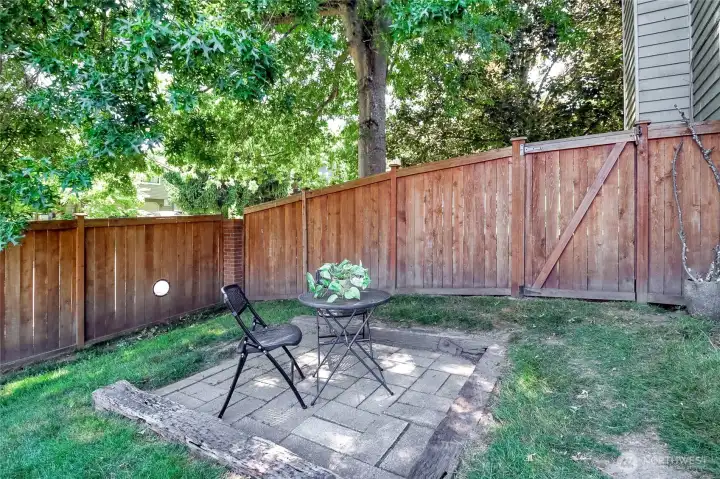 This back yard patio provides ideal afternoon shade under the big oak tree.