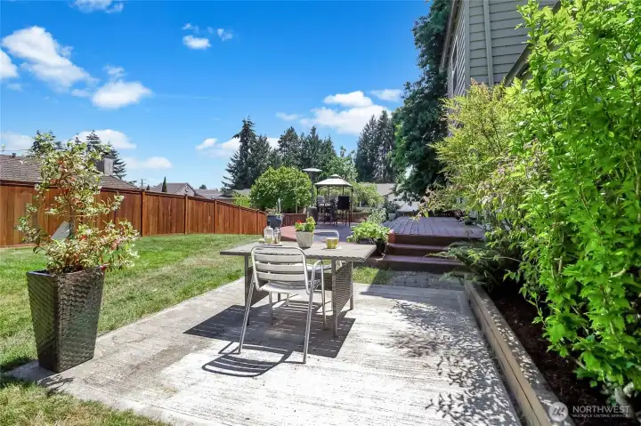 This concrete slab in the back yard was originally used or a hot tub and could be used for your future hot tub.  Or  simply use as a patio