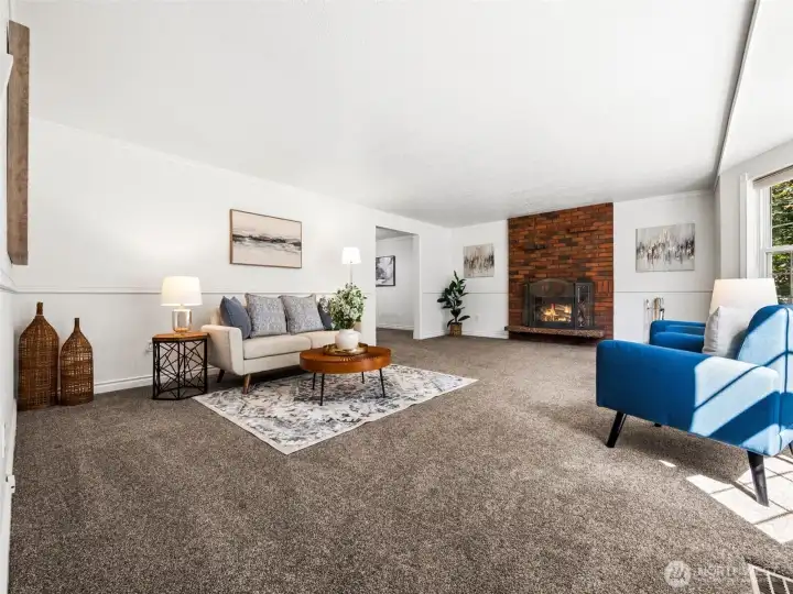 As you come in there's a HUGE living room with wood burning fireplace.