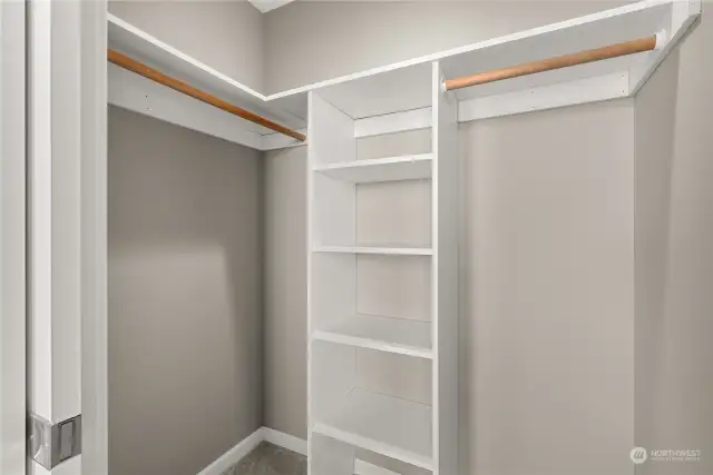 Primary bedroom has a walk-in closet with built-in shelving.