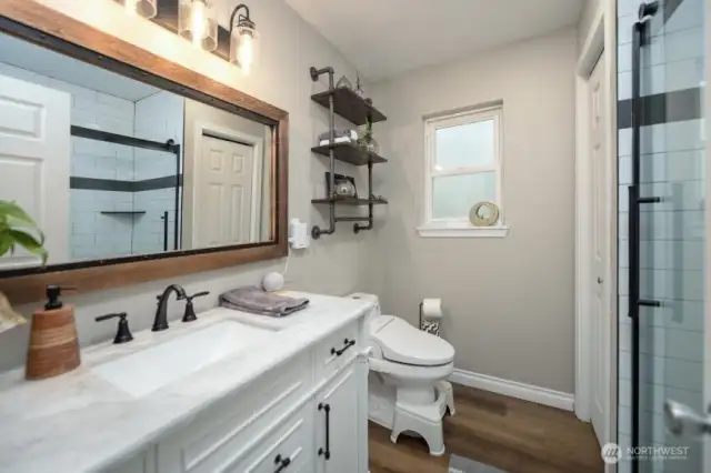 Enjoy this stunning updated bathroom. Linen closest for added storage.