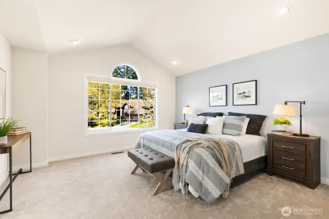 Primary Bedroom with vaulted ceilings.
