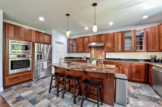 From the custom tile work to the large pantry, this kitchen with be  your centerpiece.