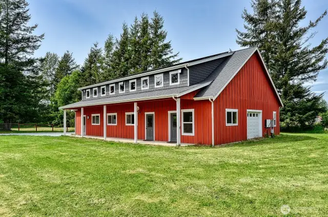 A beautiful shop with lots of doors and windows make this structure a winning addition to this property.