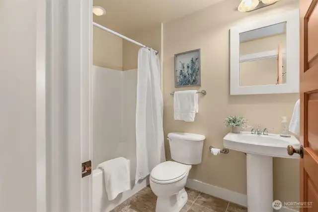 A full guest bathroom is conveniently located just across from the office for added comfort and flexibility.