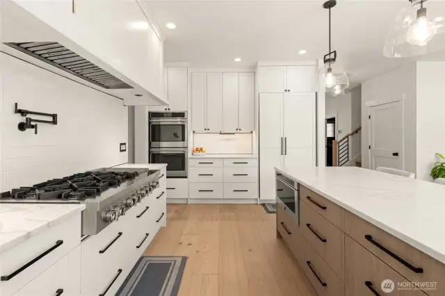 Column Style Fridge/Freezer and 48" Gas range are JennAir appliances. Double over and build-in microwave are Cafe appliances. If you like to host and prepare food, this thoughtfully designed kitchen is what you've been waiting for.