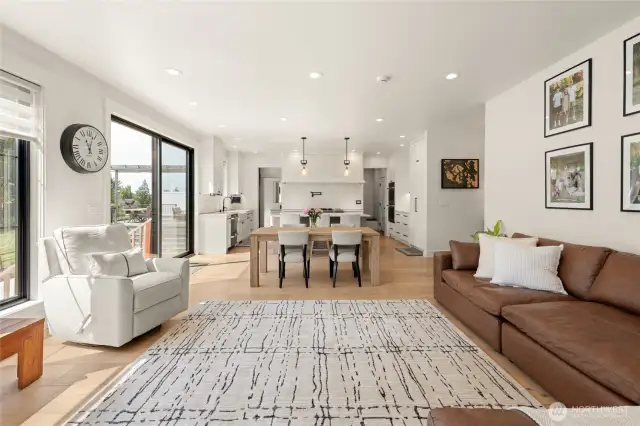 View of the Living space/Kitchen with the gas fireplace directly behind the POV.