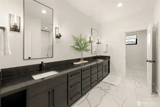 Extended double vanity with separate walk-in closet & commode.