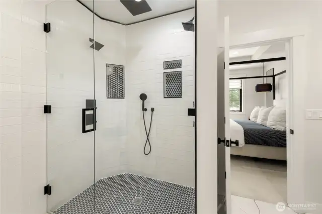 Primary Suite shower has multiple shower heads w/featured waterfall.