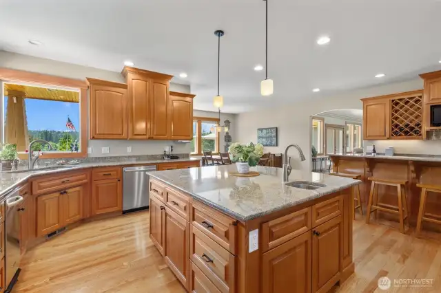 Gourmet kitchen features full prep island with prep sink. Cabinets Galore!