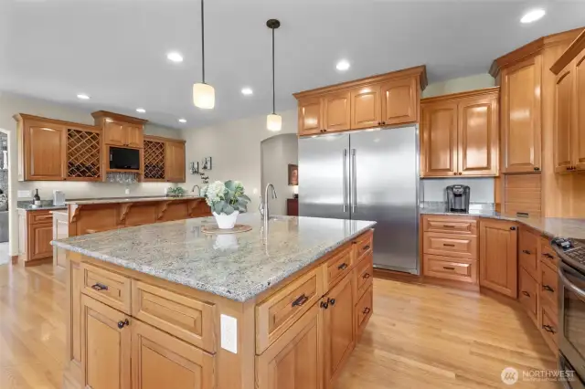 So much great lighting including under-counter lighting! Look at that fun wet bar with TV and wine service area!