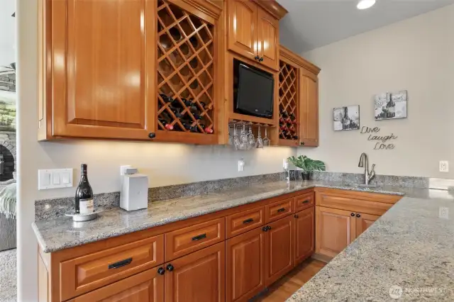 Enjoy fun times entertaining with this wine serving area and wet bar!