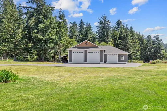 This is a gorgeous shop on these 10 acres! Equipment/Wood storage to the left side and also behind the shop area.