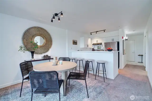 Dining room and additional eating space at the kitchen bar.