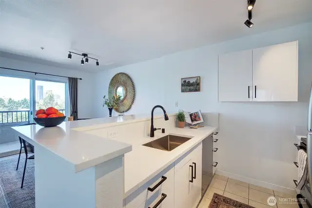 New cabinets, countertops and hardware. Sink has a garbage disposal.
