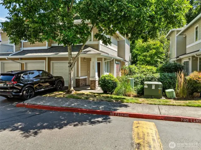 One car garage PLUS off street parking for 1 car.  (Subject garage is the middle one)