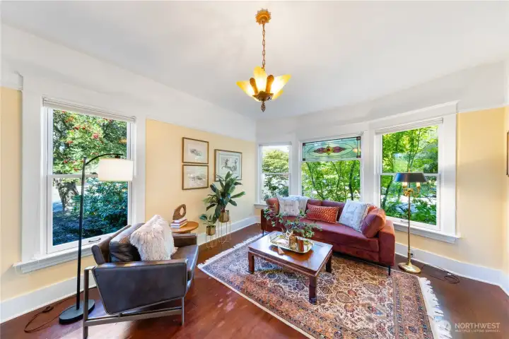 Large picture windows for natural light and to enjoy the blooming flowers.