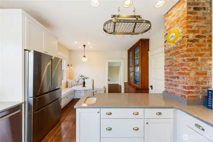 New Quartz countertops, don't miss the prep sink, all new drawers and cabinets.  Newer appliances.  Clean, light and bright.  Move-in Ready.