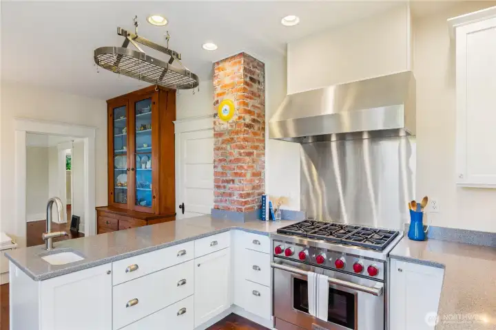Here's another photo of the updated kitchen with a six burner, Wolfe Range and lots of counter space.  There is also under mount lighting.