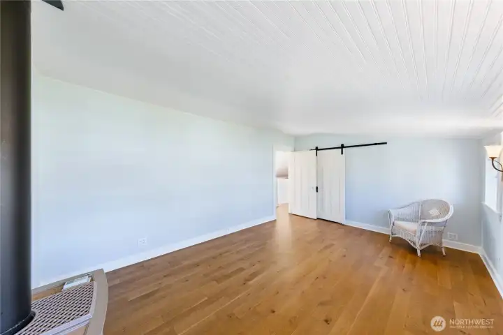 Here's a photo of the large Bedroom with a walk-in closet is at the far end behind the door.  This space is huge! The Bathroom is just across the hall right outside the Bedroom door.