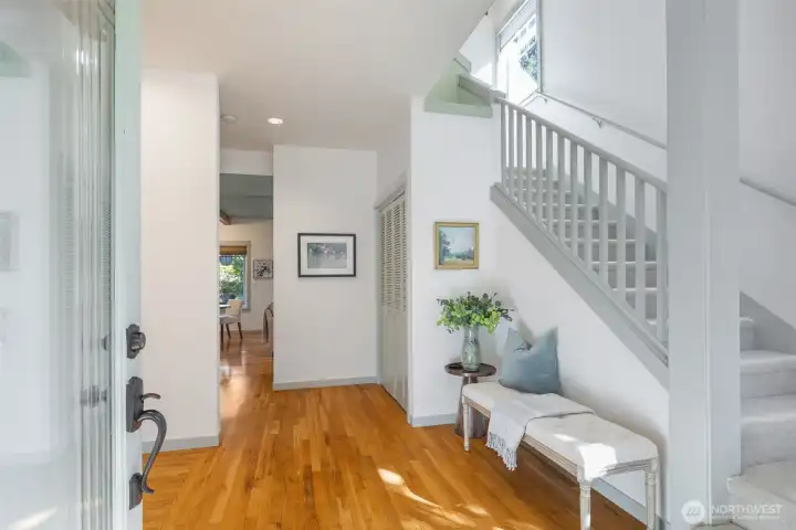 A welcoming entrance provides a puncutation between the upstairs on the right, living room on the left and the the family/great-room and kitchen to the back.