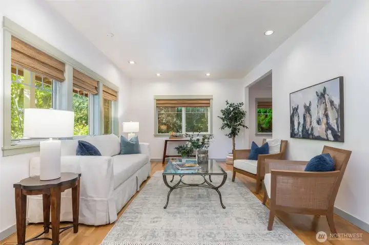 Bright, clean lines and wood floors avail a living room space, perfect to create your own vision.