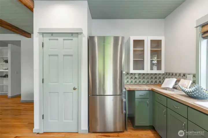 Addtional storage/pantry for this sweet kitchen with all the warmth of a friendly space for cooking.