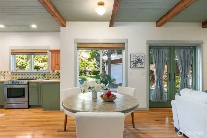 Imagine dining in the kitchen w/french doors opening to the garden and a cozy fire in the sweet family room to the right. What a great way to spend a morning breakfast or a lovely lunch with friends or family.