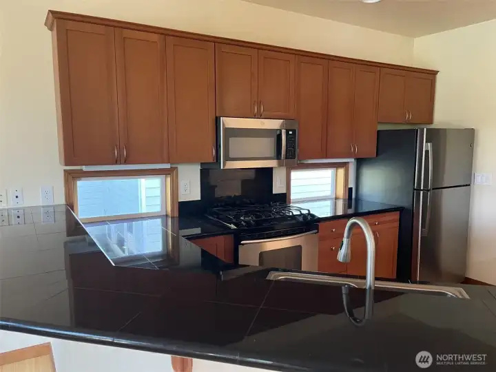 Windows at counter-level really help illuminate the kitchen.