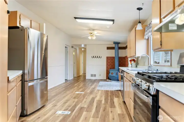 View back towards french doors to deck & wood stove