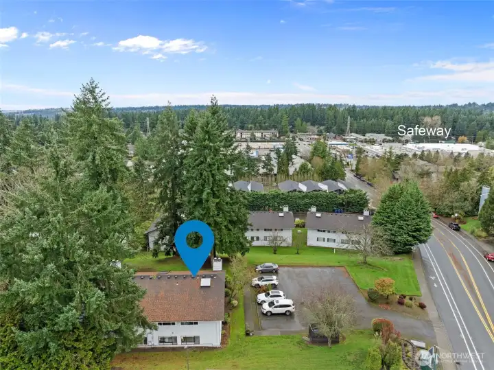 Enjoy close proximity to Safeway, shopping, dining, and major routes, all while surrounded by mature evergreens and a peaceful residential setting.