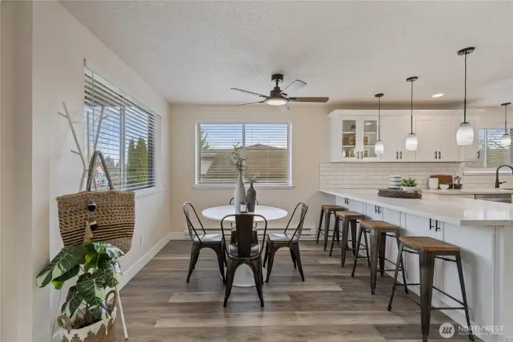 Dining area with eat up kitchen bar featuring additional storage