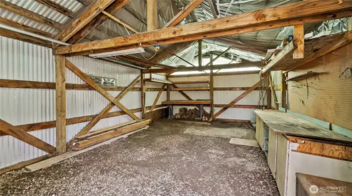 1-Car Garage with a workbench and storage space.