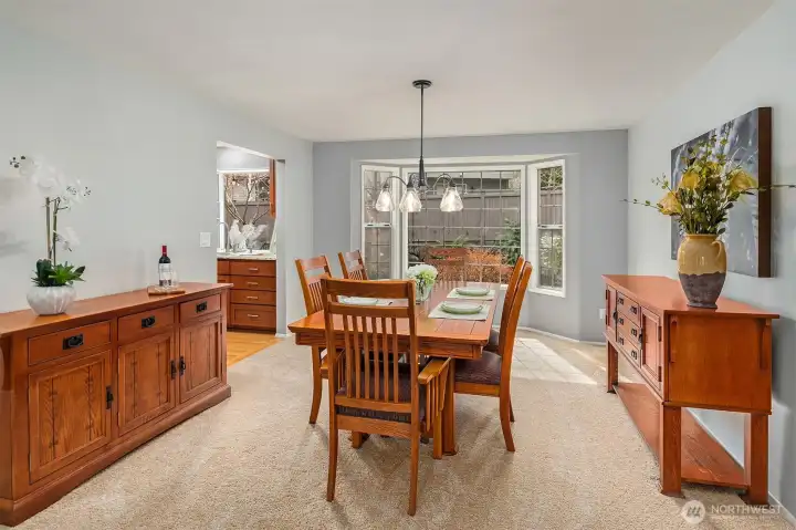 Formal dining room overlooking beautifully landscaped backyard
