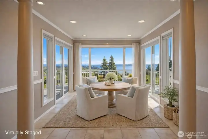Just beyond the kitchen, a room unfolds that feels like an unveiling offering an uninterrupted 180-degree panorama that shifts with the hour and the season. It's a living canvas, always in motion, always in dialogue with the space it surrounds.
