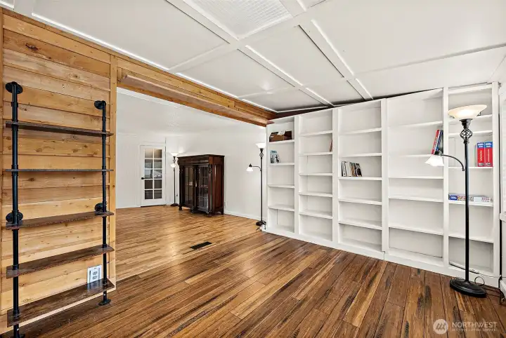 A whole wall of built-in shelving provides so much storage or space for decorating.