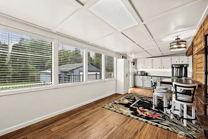 Wall of windows provides so much light for your morning coffee and enjoy golden hour dinners. Hardwood floors continue across the main floor living areas.